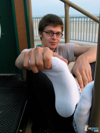 Taylor shows off his socks and feet