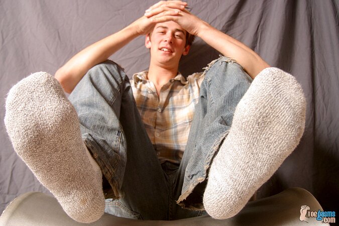 Shane Allen shows off his socks and feet