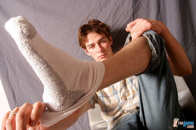 Shane Allen shows off his socks and feet