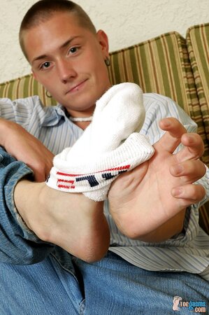 Seth Evans shows off his socks and feet