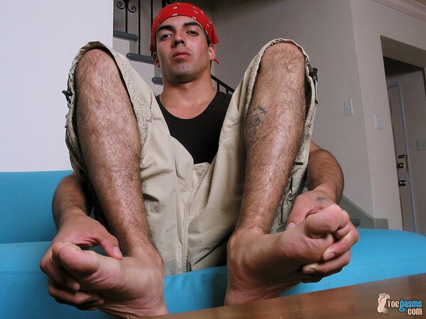 Jason shows off his dirty socks and feet