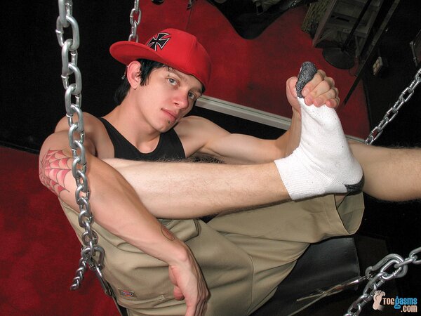 Ian Madrox shows off his socks and feet