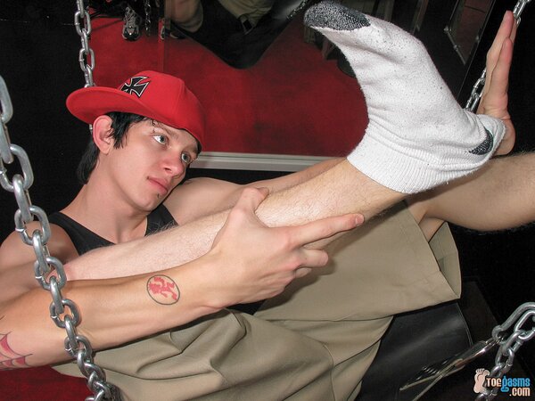 Ian Madrox shows off his socks and feet