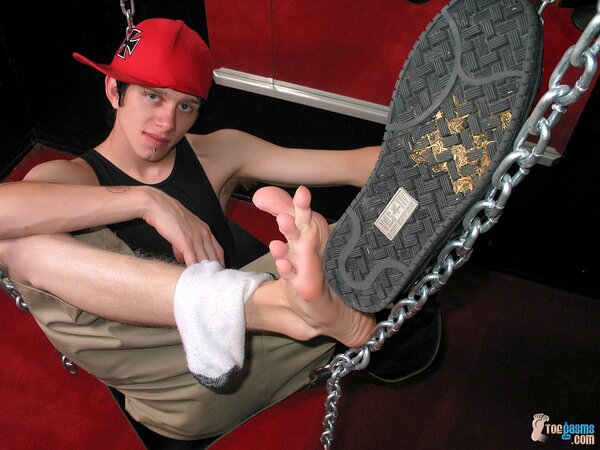 Ian Madrox shows off his socks and feet