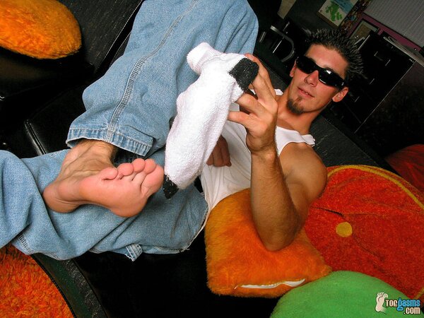 Evan Heinze shows off his socks and feet