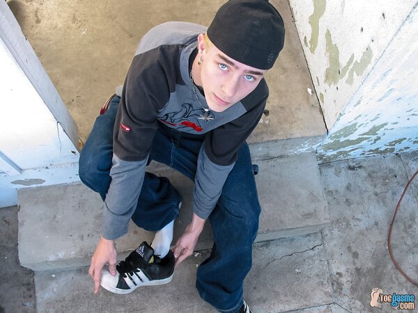 Kelly Cooper shows off his sneakers and socks