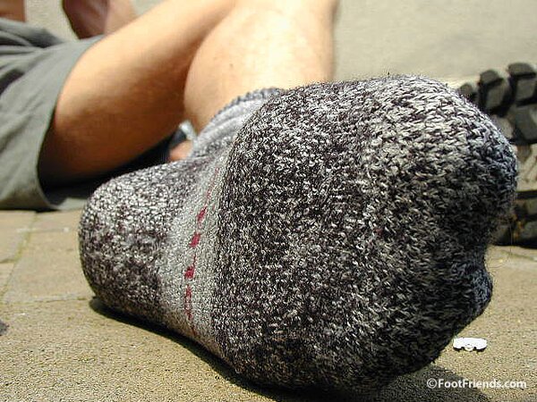 Mr. Gay London shows off his socks and feet