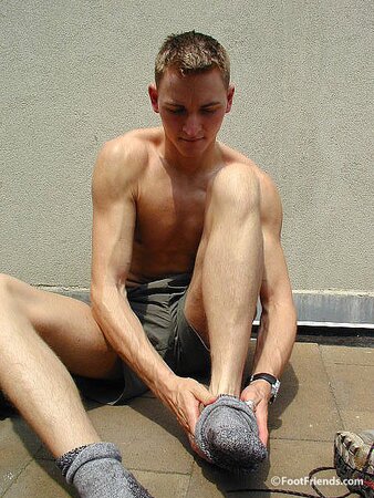 Mr. Gay London shows off his socks and feet