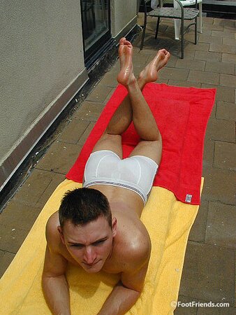 Mr. Gay London shows off his socks and feet