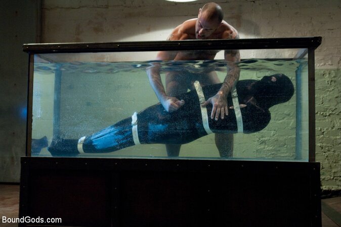 Bound in the sleepsack, submerged under water and made to cum