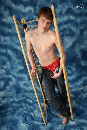 Petite twink Renat feels his erection and shows it off