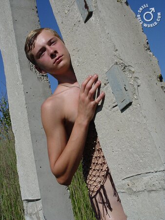 Kon poses in a net outside, looking like a caught fish