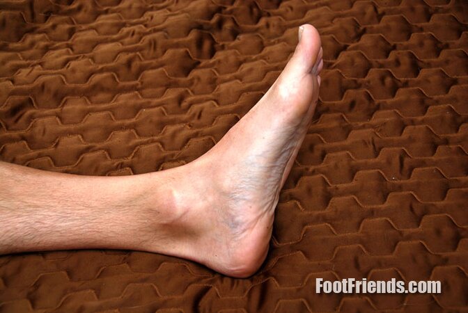 AJ flaunts his big feet in fresh athletic socks