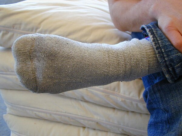 David teases with his smelly sport socks and playful feet