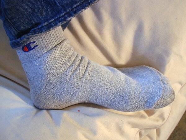 David teases with his smelly sport socks and playful feet