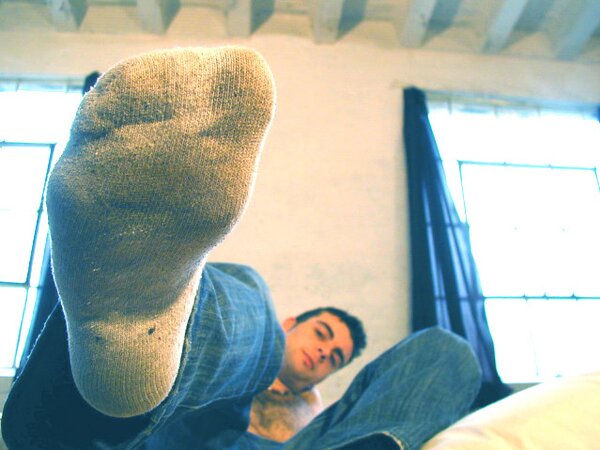 David teases with his smelly sport socks and playful feet