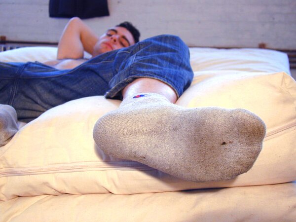 David teases with his smelly sport socks and playful feet