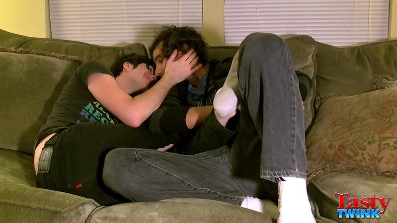 Tristan and Aron share a romantic kiss while touching feet