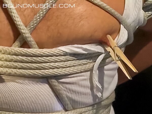 Dominik Mann feels pleasure and pain with nipple clamps