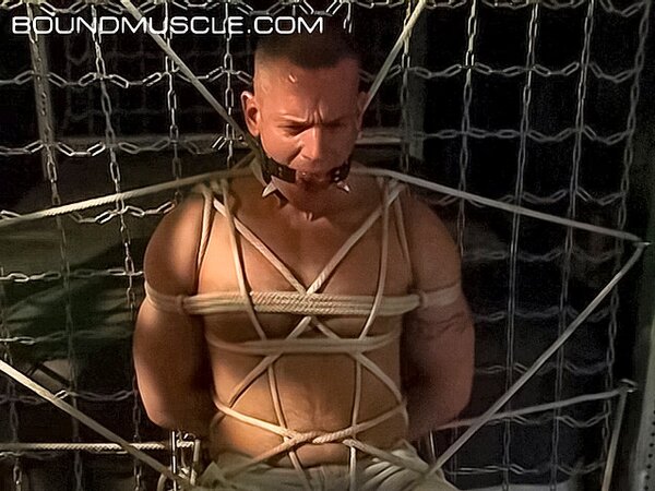 Bound Bigg Pete can't speak with a ball gag in his mouth