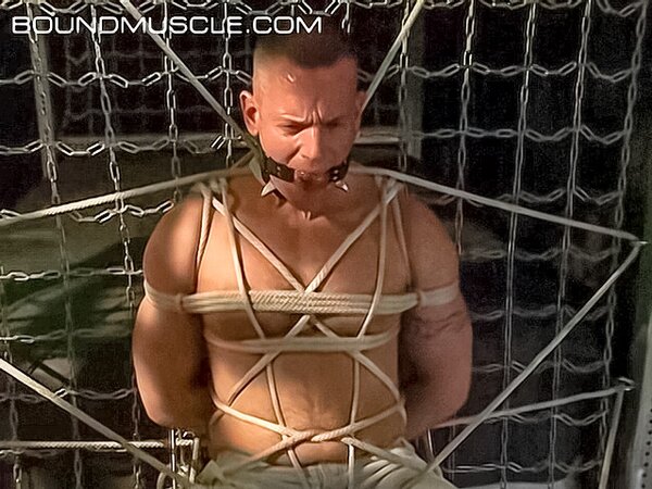 Bound Bigg Pete flexes his huge biceps in rope bondage