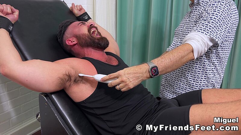 Muscle man Miguel laughs uncontrollably as his sexy size 11 feet are tickled