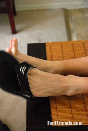 Scruffy brunette Bryce enjoys a relaxing foot massage