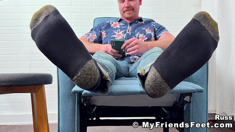 Russ takes off his shoes and socks to display his delectable feet