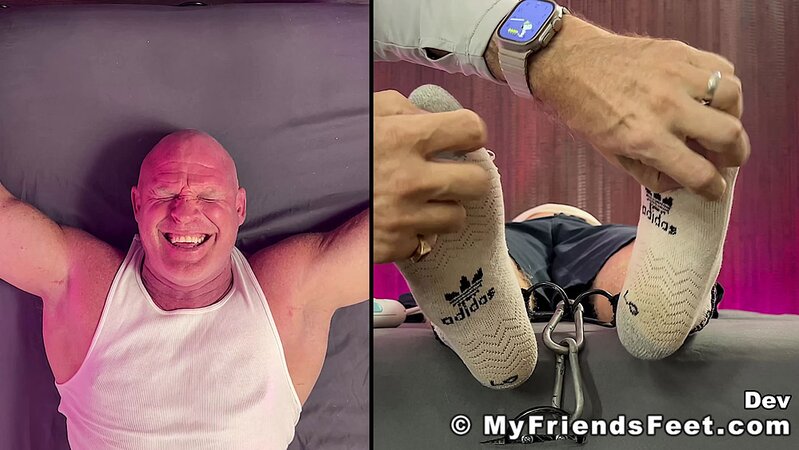 Dev tries to resist but can't help laughing during tickling torture