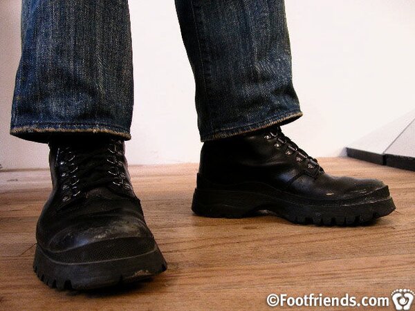 Tommy shows off his tough side in black contractor boots and a jock