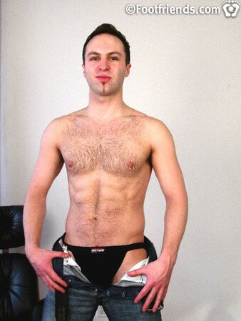 Tommy shows off his tough side in black contractor boots and a jock