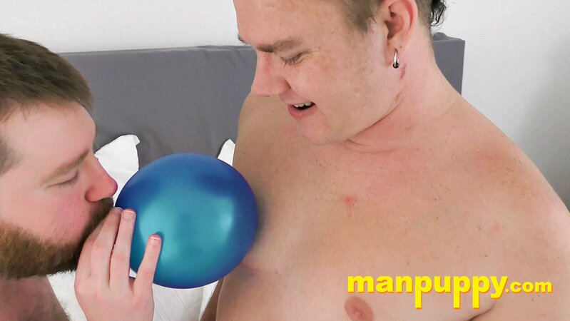 Leo Blue rubs balloons on Kaleb DeWulf’s belly