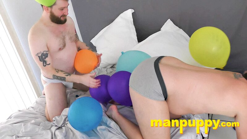 Leo Blue rubs balloons on Kaleb DeWulf’s belly