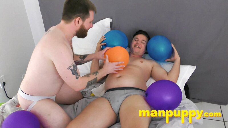Leo Blue rubs balloons on Kaleb DeWulf’s belly