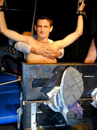 Ken tickles Alex in stocks and makes him laugh