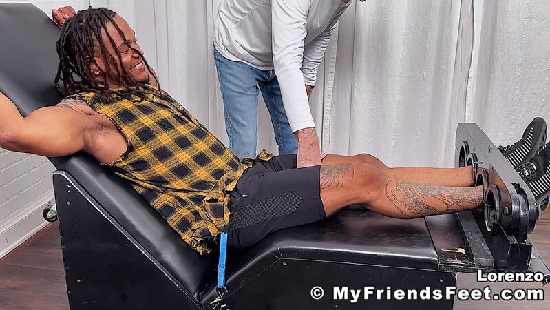 Lorenzo laughs hard as Dan Edwards tickles his ribs