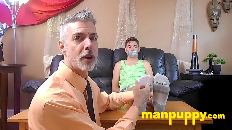 Richard Lennox uses feathers on Devin Jones’s bare soles