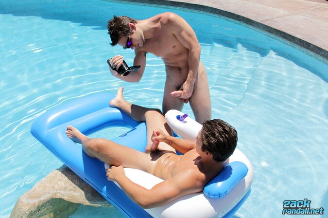 Zack Randall gets his uncut cock stroked by Jizzy McBone in the sun