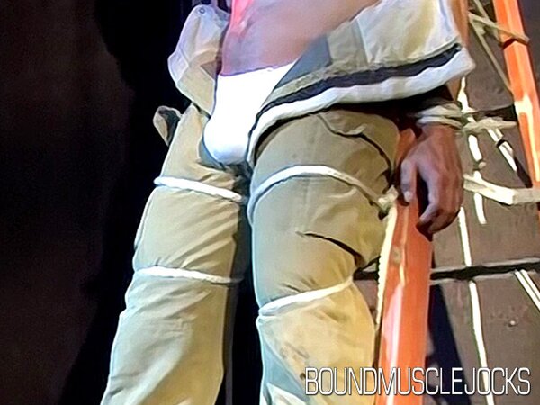Duke Rivers is gagged and bound, showing off his big body