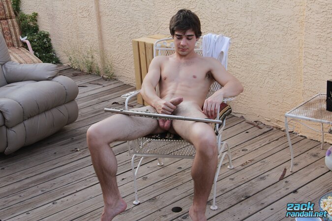 Zack Randall plays his flute and slips the mouthpiece into his foreskin