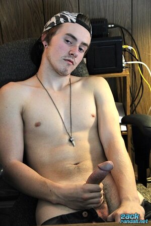Ty Evans strips in the office and jerks his big cock over the desk