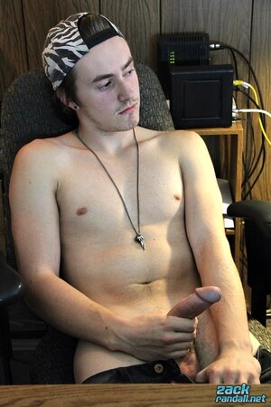 Ty Evans strips in the office and jerks his big cock over the desk