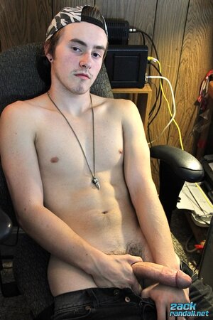 Ty Evans strips in the office and jerks his big cock over the desk