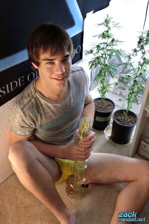 Smoking and stroking, Zack Randall splashes cum all over his pipe