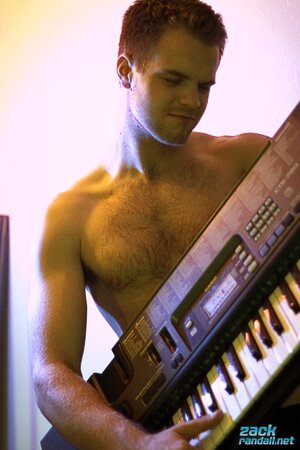 Billy Club teases with sexy poses and soft lighting in a hot gym shoot