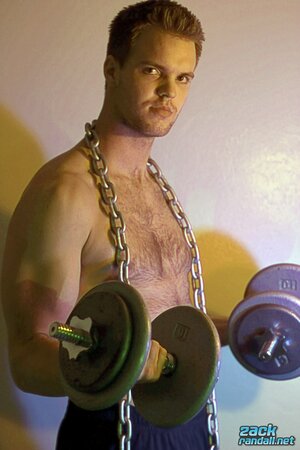 Billy Club teases with sexy poses and soft lighting in a hot gym shoot