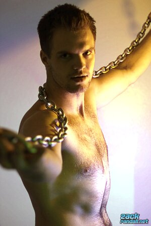 Billy Club teases with sexy poses and soft lighting in a hot gym shoot