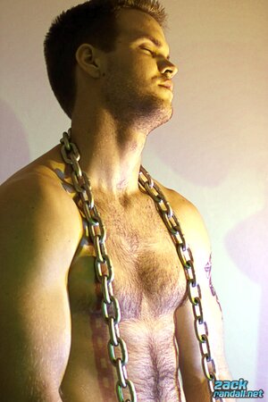 Billy Club teases with sexy poses and soft lighting in a hot gym shoot