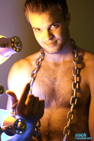 Billy Club teases with sexy poses and soft lighting in a hot gym shoot