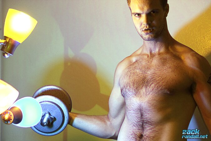 Billy Club teases with sexy poses and soft lighting in a hot gym shoot